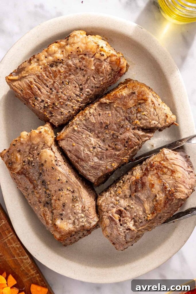 Browning beef short ribs in skillet for rich and flavorful ragu
