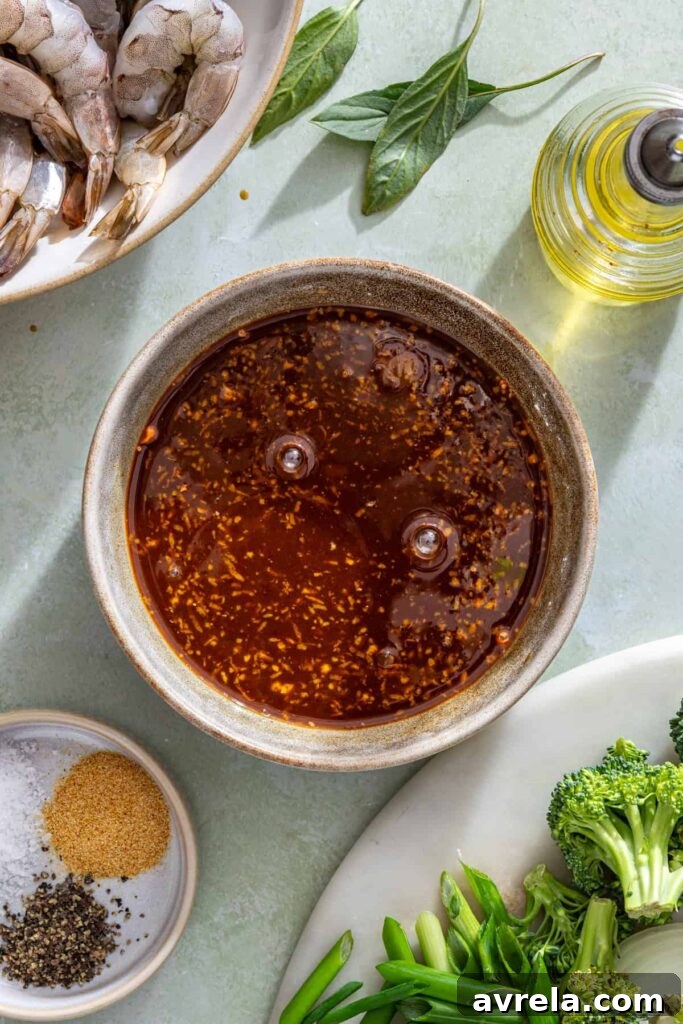process shot of homemade sauce coming together in a small bowl for stir fry
