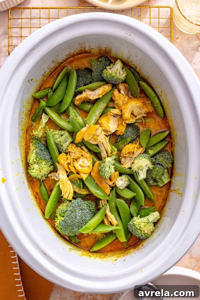 Slow Cooker Coconut Chicken Curry Recipe for Tender, Flavorful Meals 13 adding broccoli and snap peas to slow cooker chicken curry