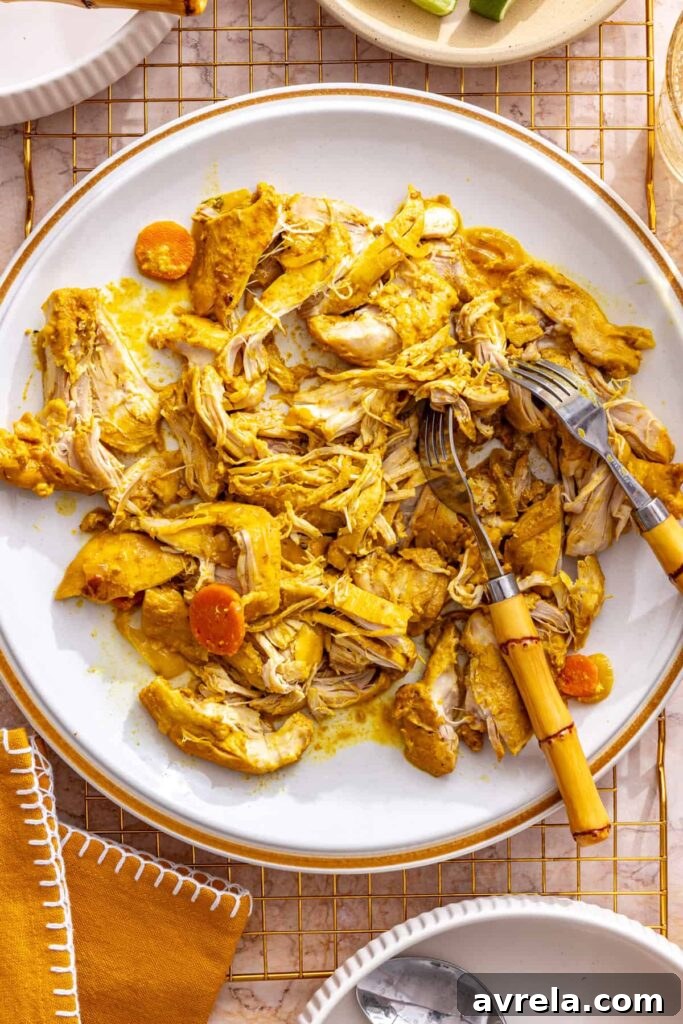 Slow Cooker Coconut Chicken Curry Recipe for Tender, Flavorful Meals 17 shredding tender chicken for healthy slow cooker chicken curry