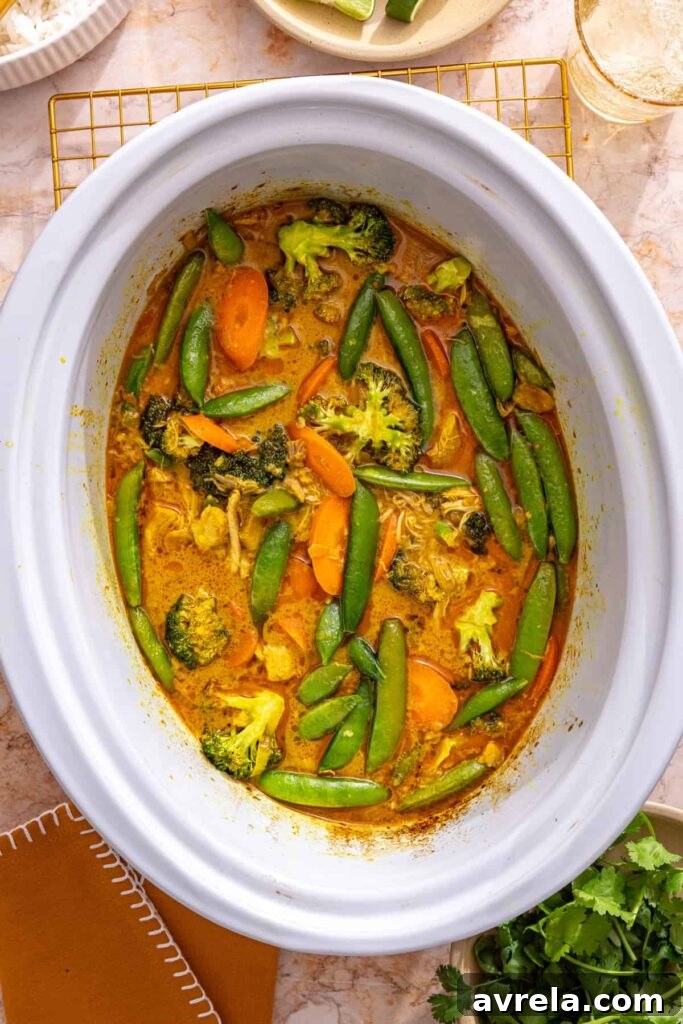 Slow Cooker Coconut Chicken Curry Recipe for Tender, Flavorful Meals 5 finishing slow cooker curry with green vegetables