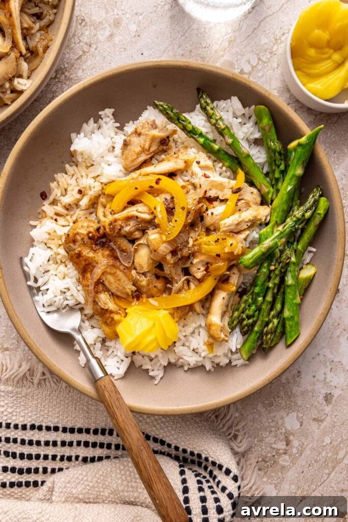 Overhead view of cozy chicken thigh rice bowl on a styled table