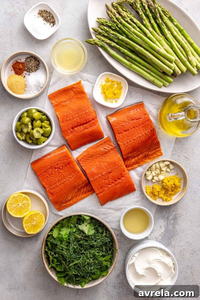 Ingredients for baked sheet pan salmon and asparagus arranged on a kitchen counter