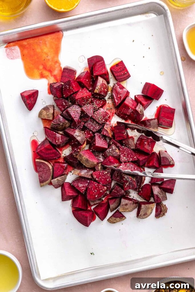 Fresh red beets chopped on a sheet pan for beet salad