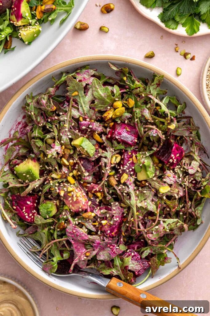 Roasted beet salad in a serving bowl on a styled table