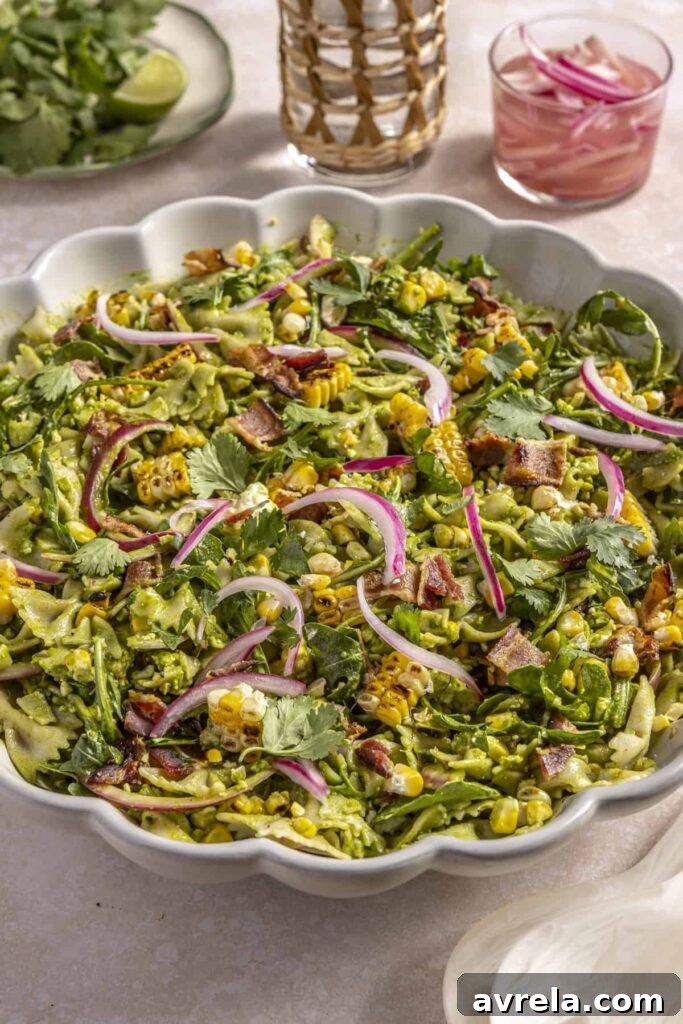 Grilled elote pasta salad with jalapeño green sauce and bacon