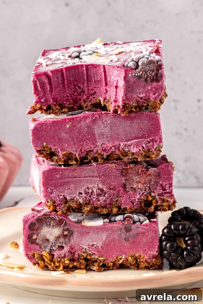 Tower of blackberry cobbler bars with coconut topping