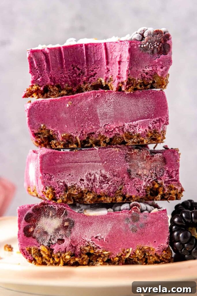 Side view of blackberry cobbler bars showing crust and filling