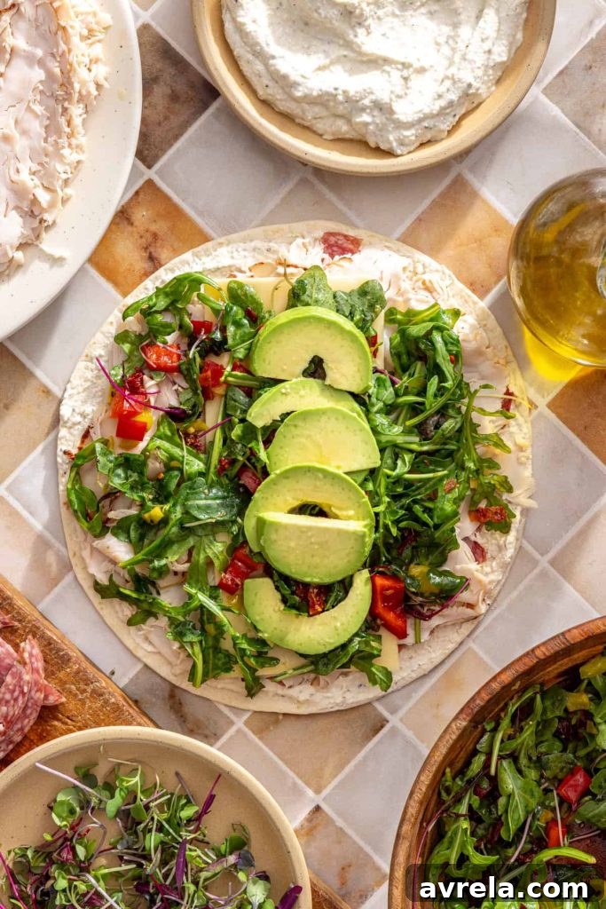 Avocado slices added down the center of turkey wrap