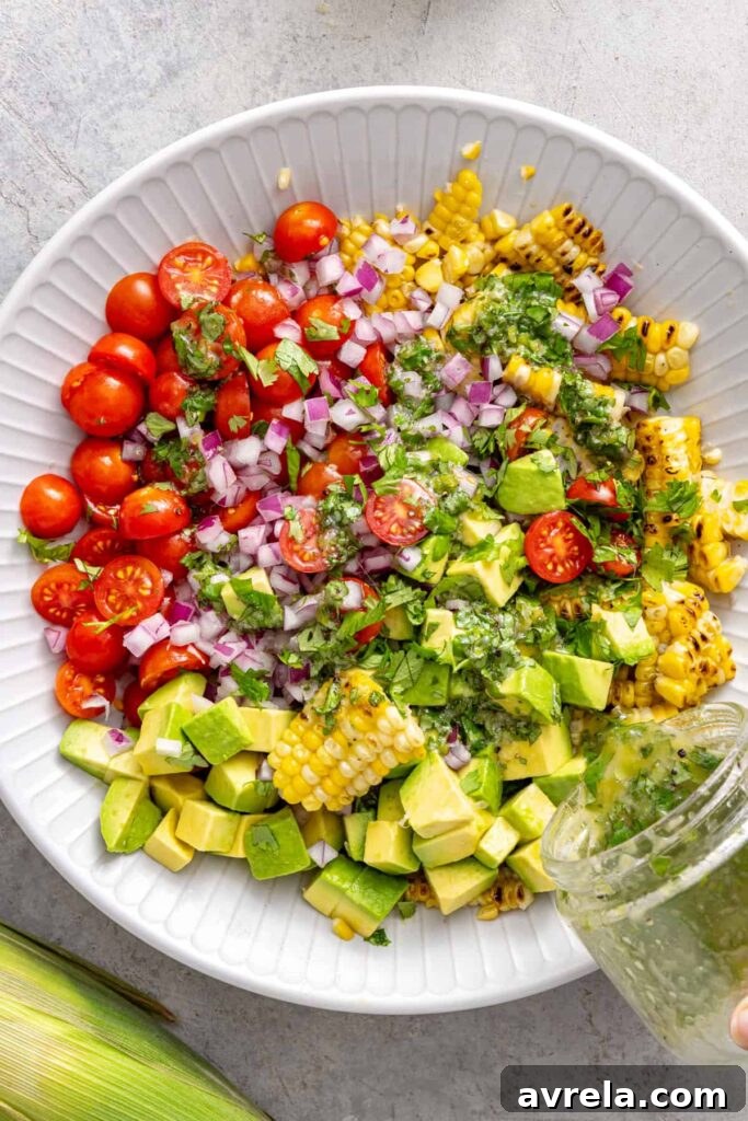 Fresh Corn and Tomato Summer Salad with Basil and Lime 4 Charred corn, tomatoes, avocado, red onion, and cilantro in a mixing bowl