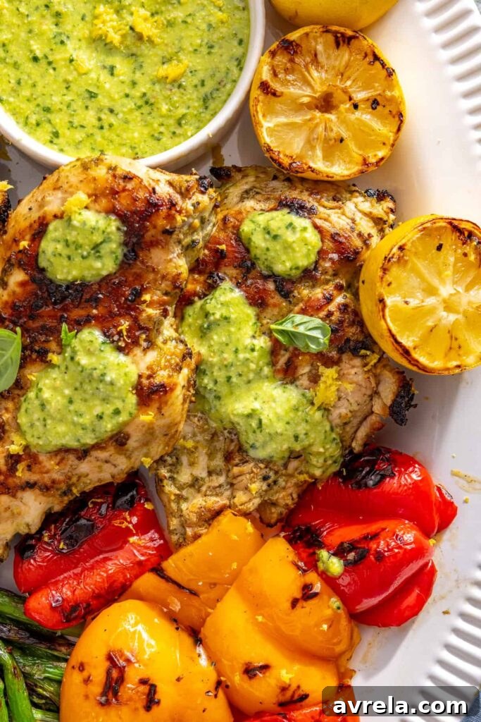 Healthy summer dinner spread with lemon pesto chicken and grilled vegetables