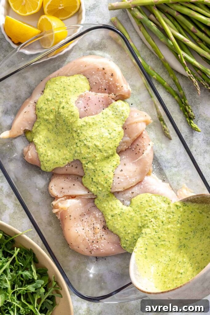 Lemon pesto chicken marinating for a healthy summer dinner