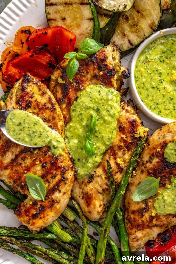 Lemon pesto chicken topped with extra homemade pesto before serving