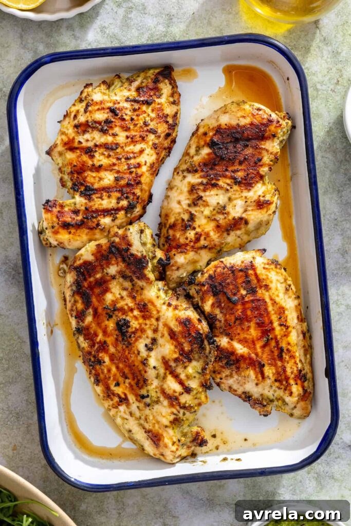 Overhead view of lemon pesto grilled chicken resting after grilling