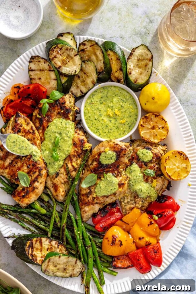 Grilled chicken with basil pesto, zucchini, asparagus, and bell peppers