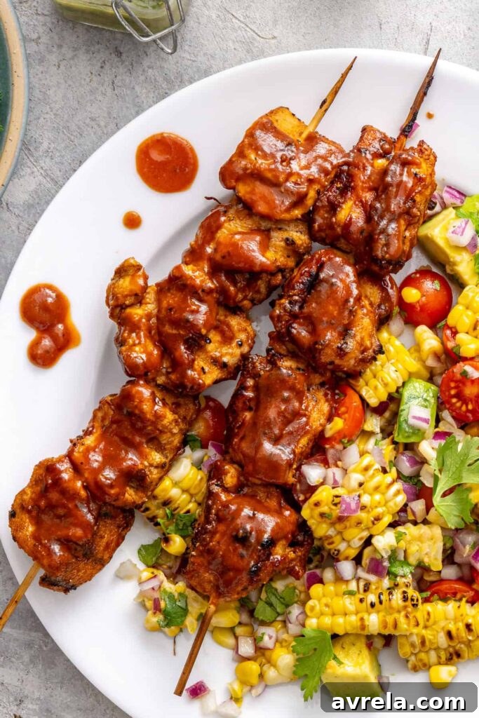 Macro-friendly BBQ chicken skewers with no sugar added BBQ sauce and a side salad