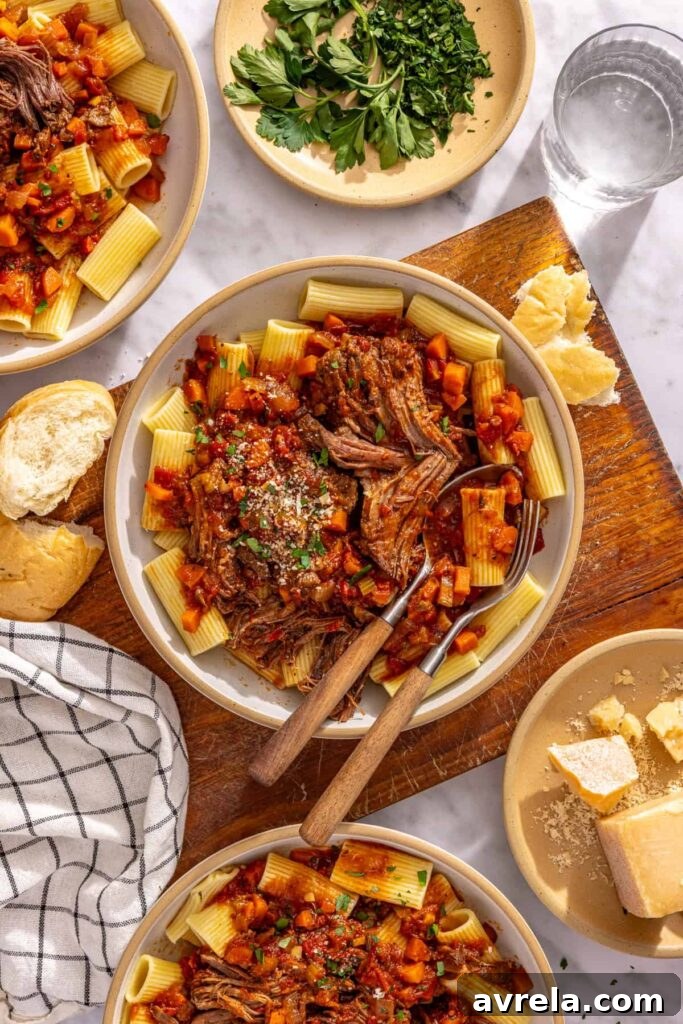 12 Delicious Gluten-Free Meal Ideas for Every Day 5 Overhead view of short rib ragu pasta with bread and fresh herbs