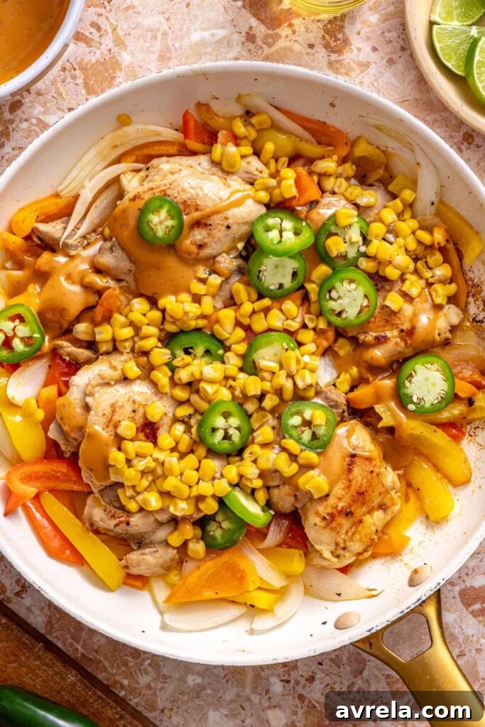 Adding corn, jalapeños, and chipotle ranch to southwest chicken skillet