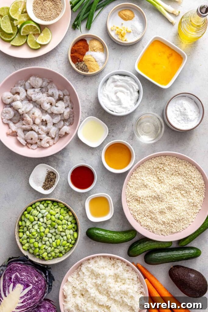 Healthy air fryer bang bang shrimp ingredients including shrimp, gluten-free panko, coconut yogurt, vegetables, rice and seasonings.