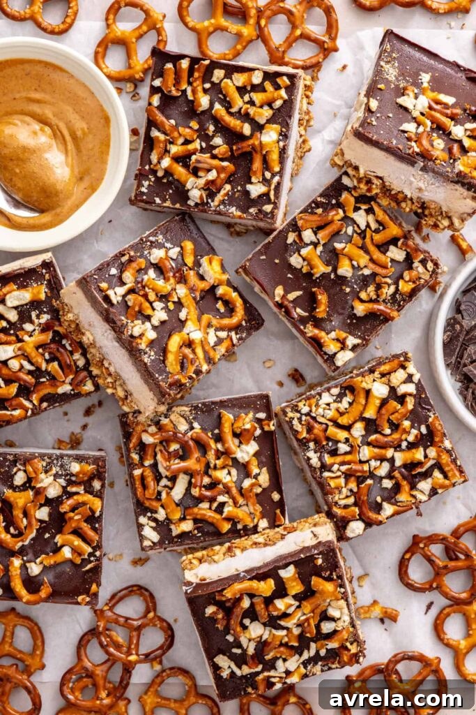 High-protein frozen peanut butter bars served with gluten-free pretzels.