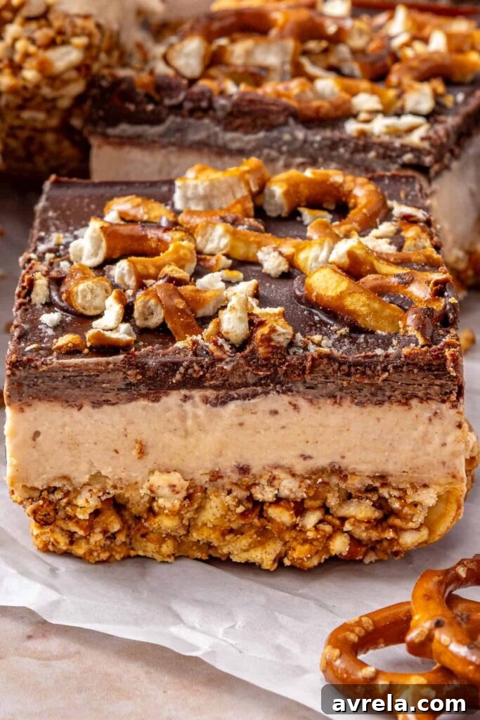 Close-up of one peanut butter pretzel frozen bar showing the layered texture.