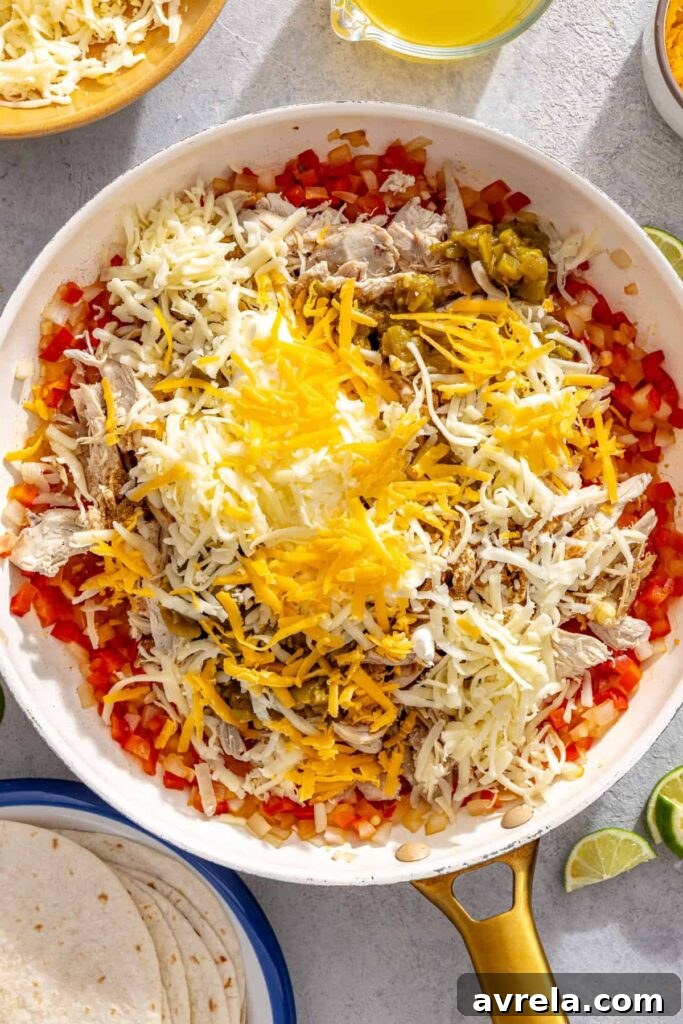 Baked Creamy Chicken Enchiladas with Salsa Verde 3 Creamy chicken enchilada filling mixed with shredded chicken, green chiles, cheese, and sour cream