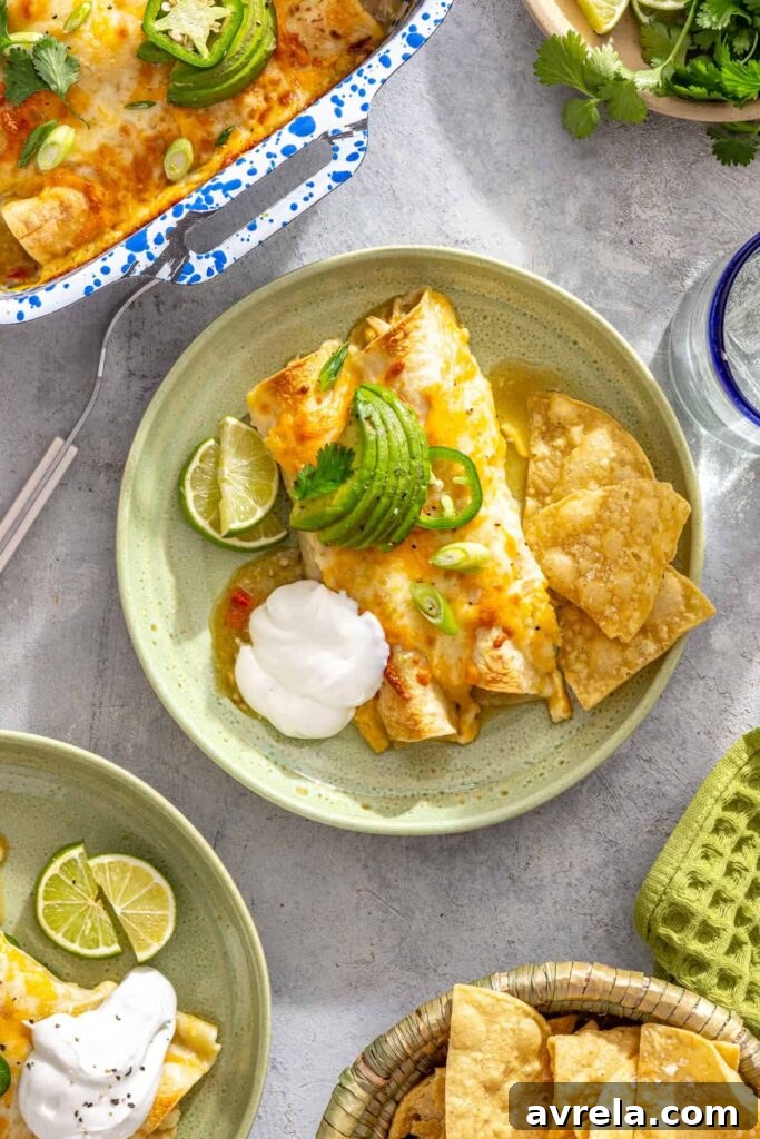 Baked Creamy Chicken Enchiladas with Salsa Verde 16 Individual serving of creamy green chicken enchiladas with tortilla chips, sour cream, and lime