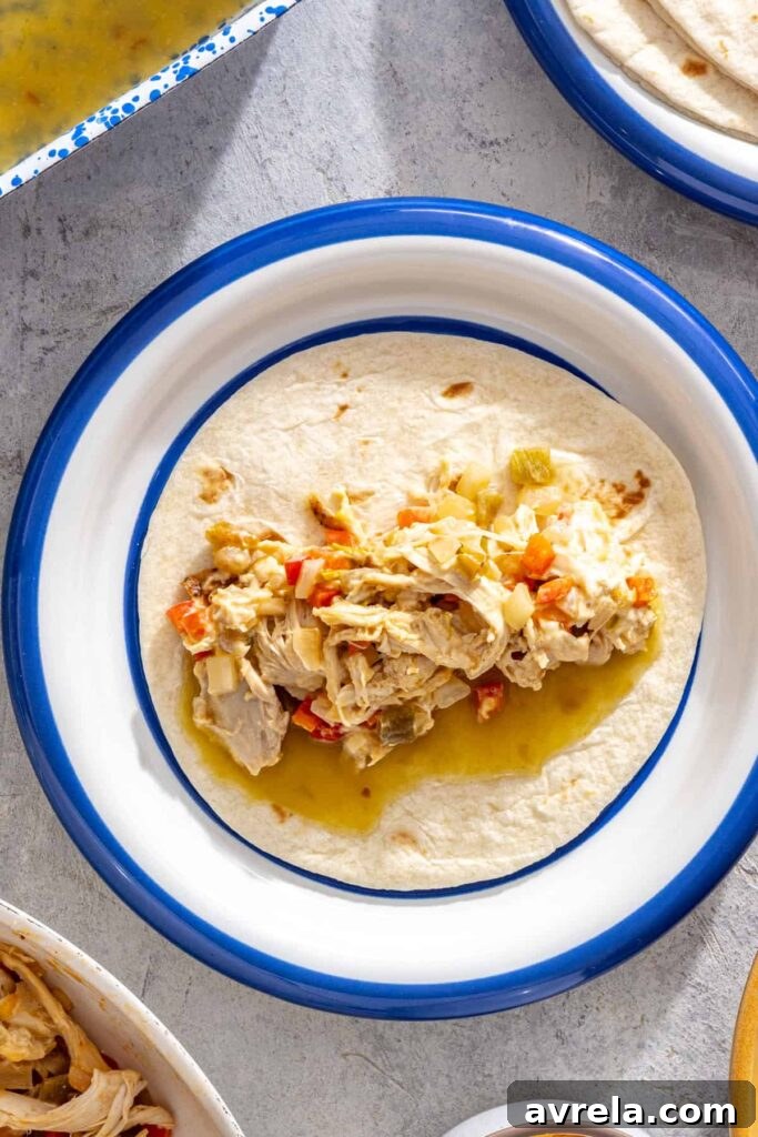 Baked Creamy Chicken Enchiladas with Salsa Verde 4 Filling tortillas with creamy shredded chicken mixture for salsa verde enchiladas