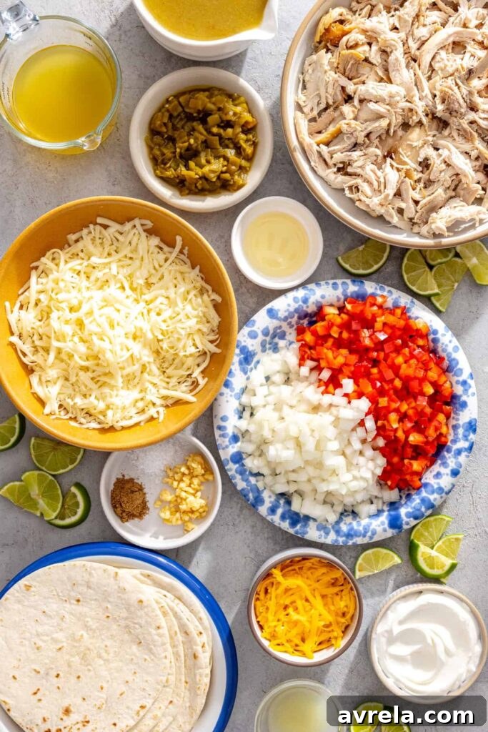 Baked Creamy Chicken Enchiladas with Salsa Verde 8 Ingredients for creamy green chicken enchiladas with salsa verde including shredded chicken, tortillas, cheeses, green enchilada sauce, vegetables, and lime