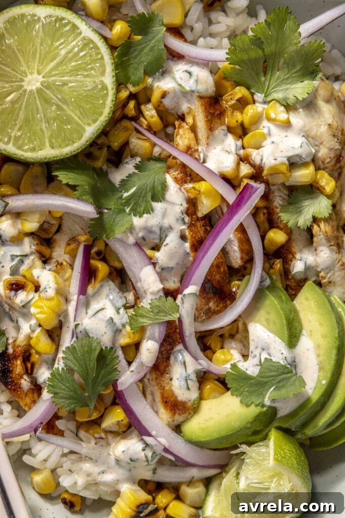 Smoky street corn chicken bowl with grilled corn and spices