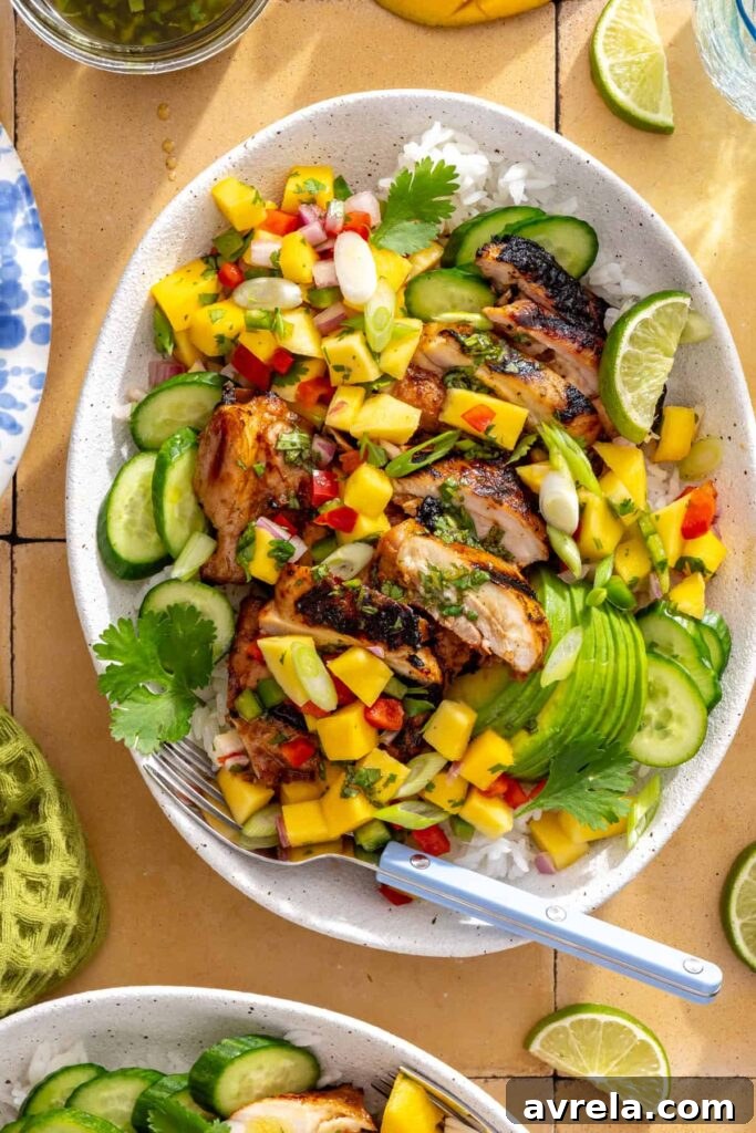 Serving honey lime grilled chicken with homemade cilantro-lime drizzle and mango salsa