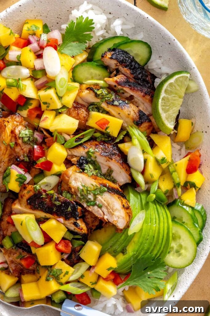tight shot of honey lime grilled chicken with mango salsa and cilantro-lime drizzle
