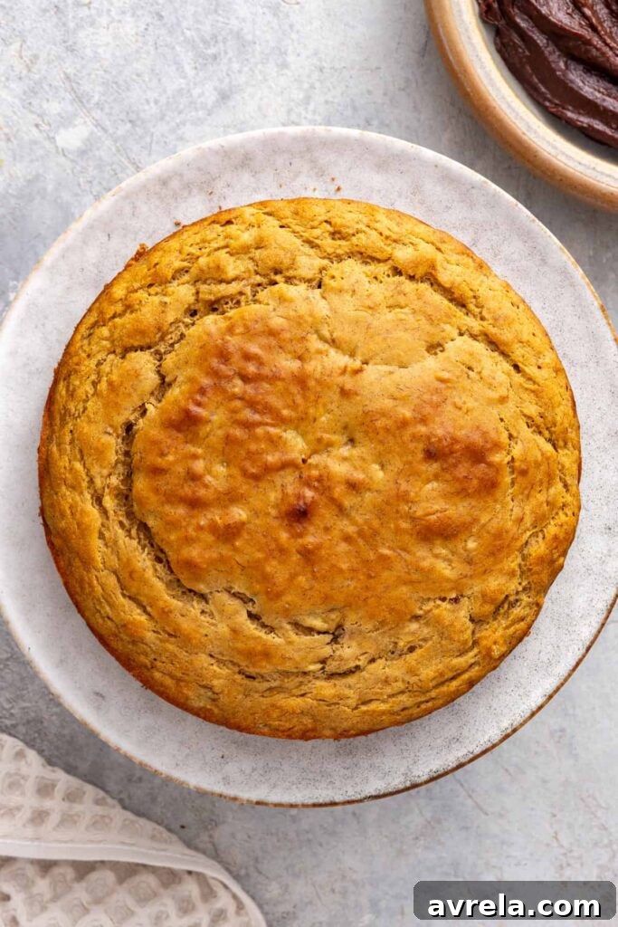 Healthy vanilla banana birthday cake on cake stand before frosting