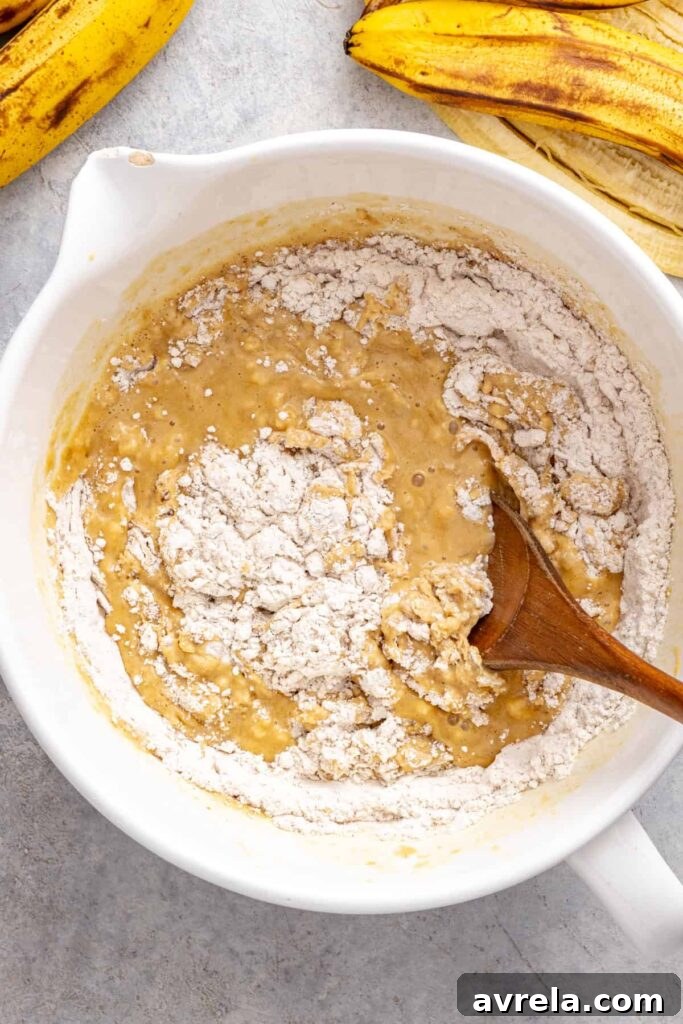 Mixing gluten-free banana birthday cake batter