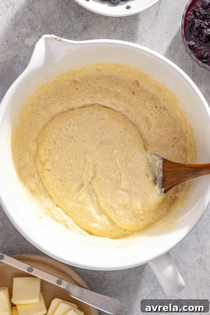 Cottage cheese pancake batter being gently folded until just combined