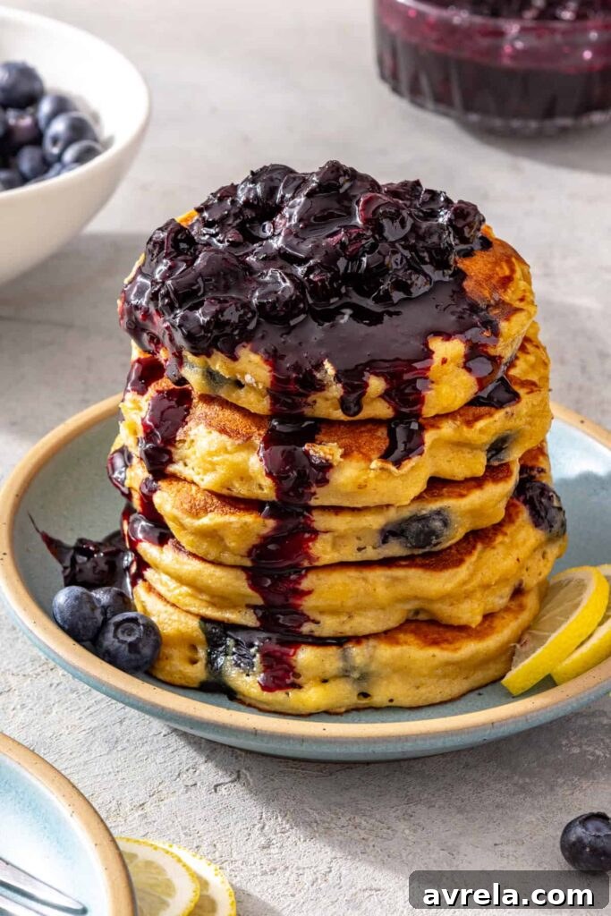 Fluffy high-protein cottage cheese pancakes topped with homemade blueberry honey compote