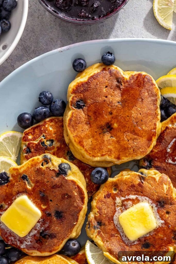 Golden lemon cottage cheese pancakes topped with melting butter