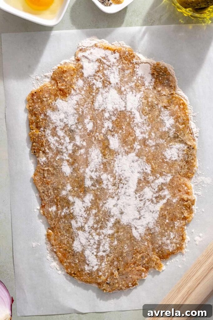 Thin giant dill pickle chicken cutlet ready for breading