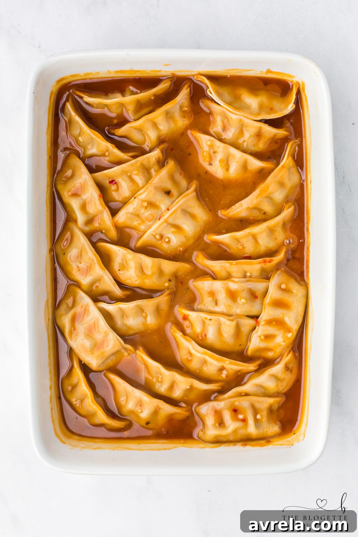 Place frozen potstickers in the sauce