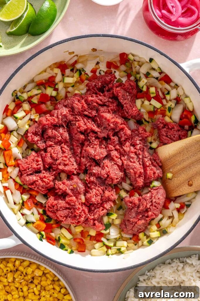High-Protein Street Corn Taco Skillet One-Pan Dinner 10 Ground beef added to sautéed vegetables for street corn taco skillet