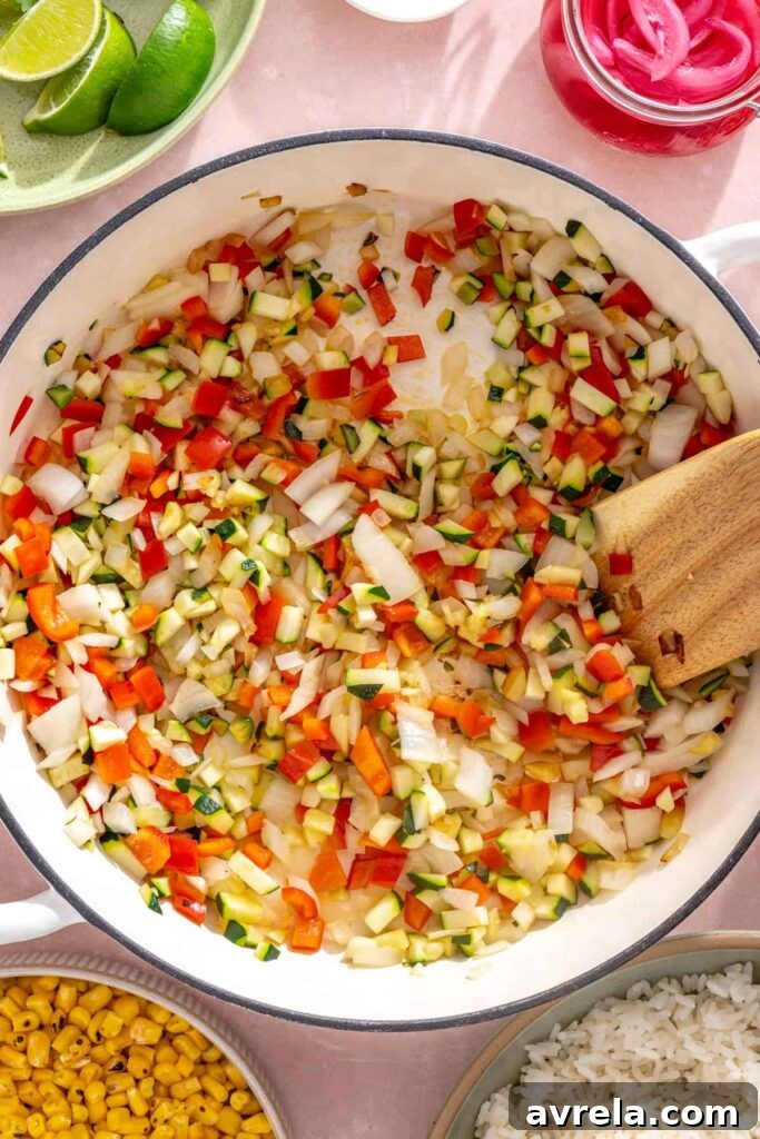High-Protein Street Corn Taco Skillet One-Pan Dinner 9 Sautéed onion, bell pepper, and zucchini softened and lightly browned in a skillet