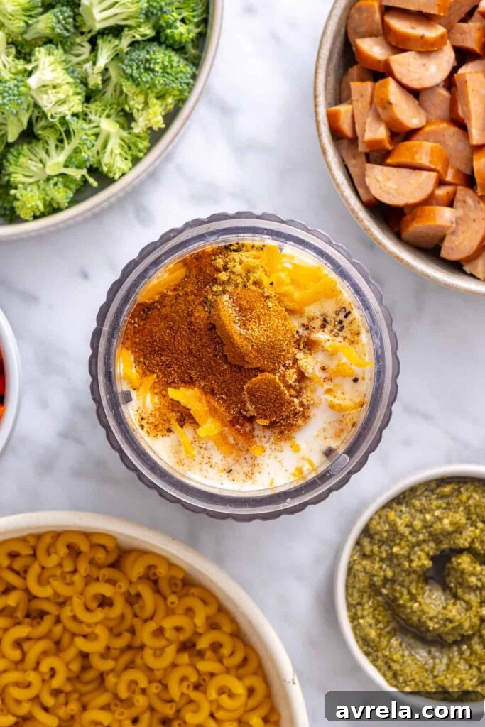 Cottage cheese, milk, shredded cheddar and seasonings added to a blender for the broccoli cheddar pasta sauce