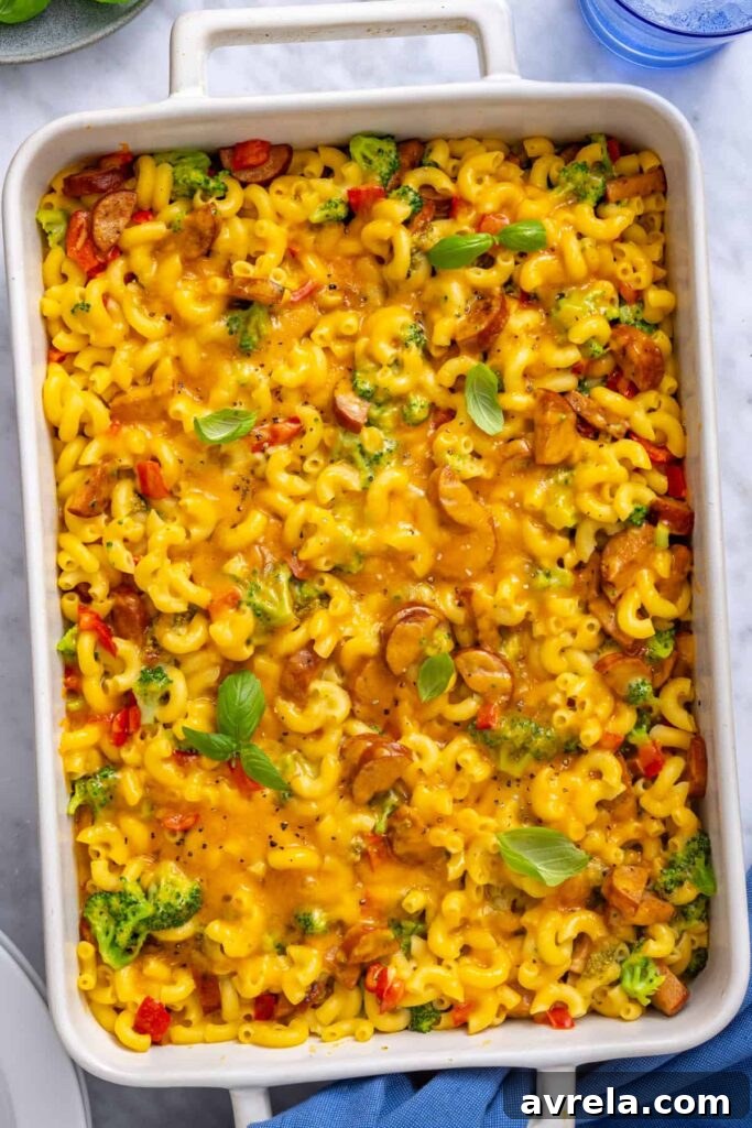 Golden baked broccoli cheddar pasta served in a 9x13 casserole dish