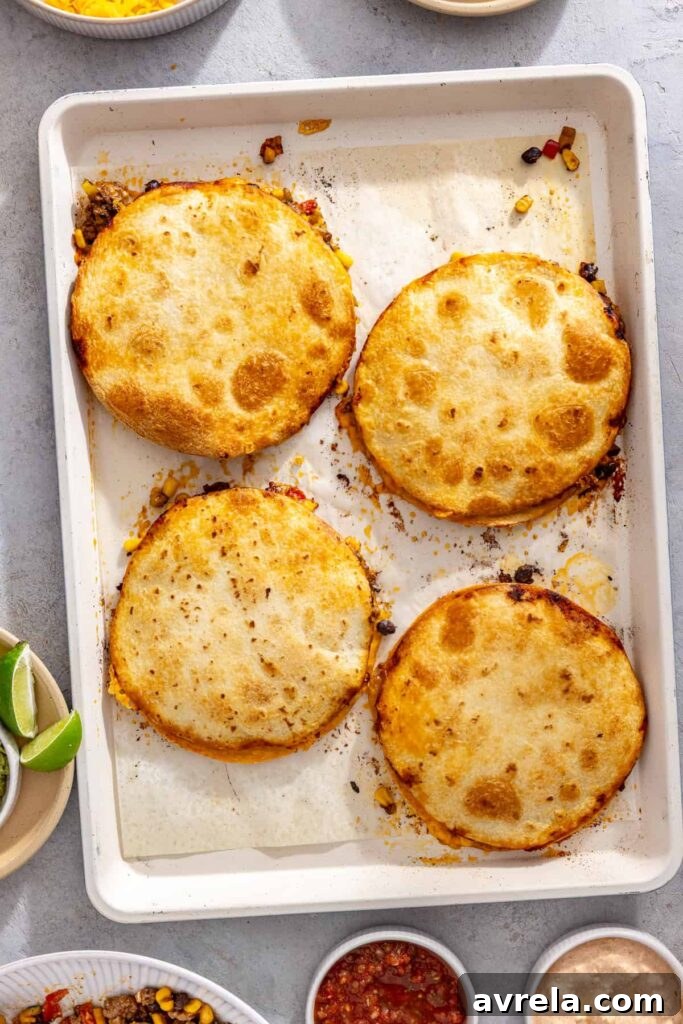 Crispy sheet pan quesadillas cooling on the baking pan before serving