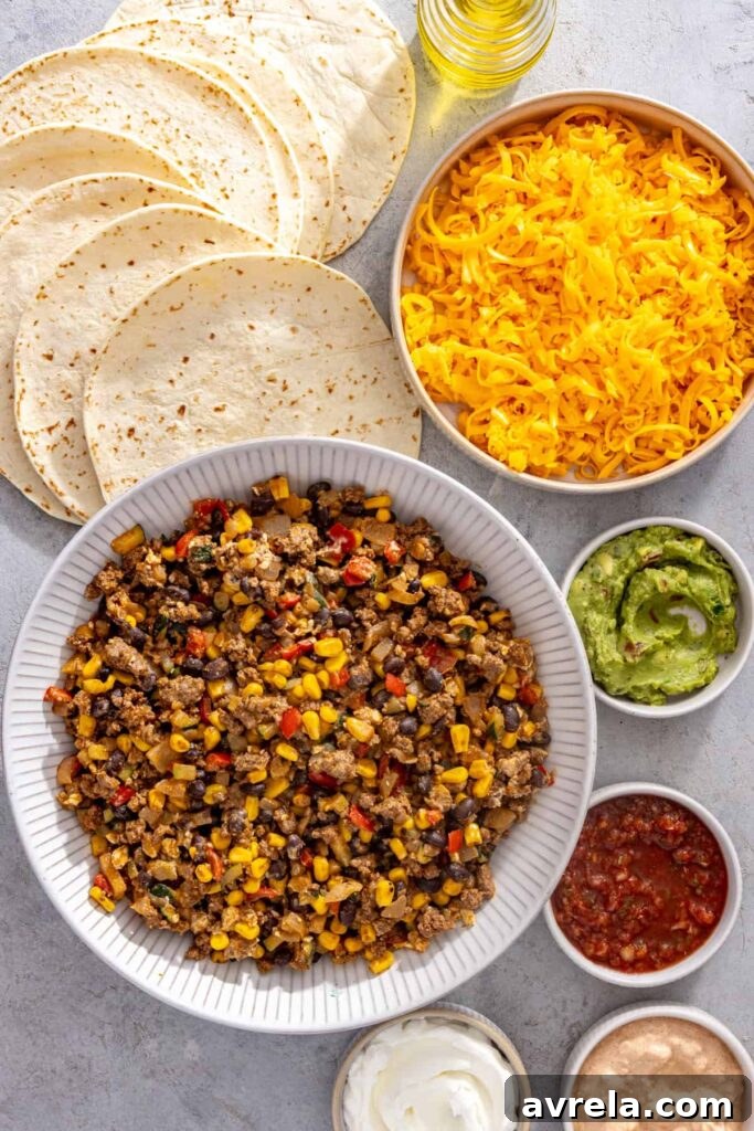 Ingredients for easy sheet pan quesadillas with tortillas, leftover street corn taco filling, cheddar cheese and avocado oil
