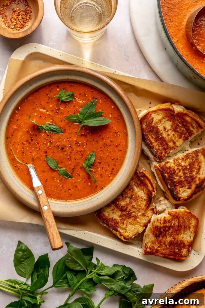 5 Comforting Soup Recipes Everyone Will Love 4 Roasted tomato basil soup served with a grilled cheese sandwich