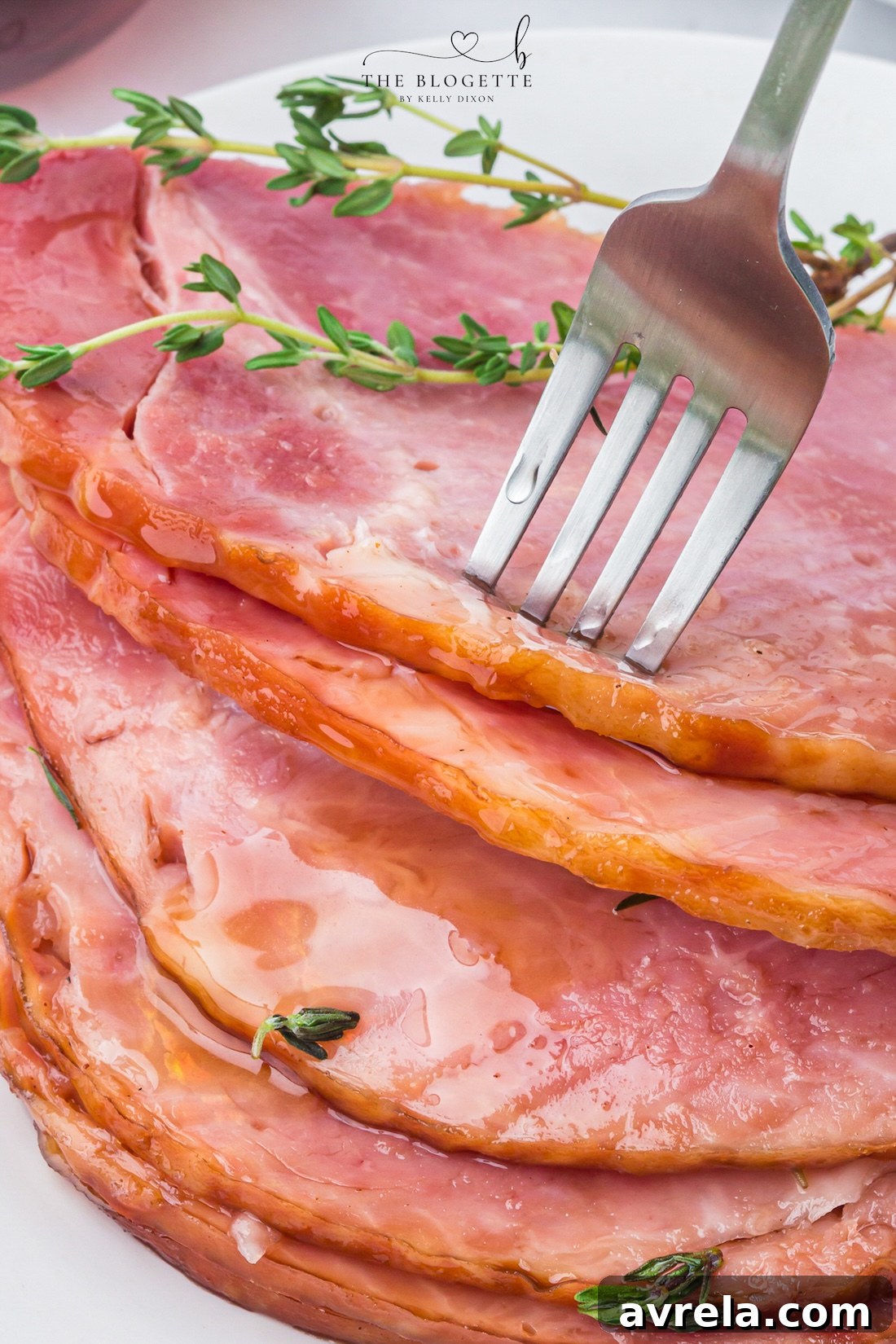 Make tender Crock Pot Ham with a maple brown sugar glaze, pineapple juice, butter, and thyme. An easy holiday ham recipe made in the slow cooker!