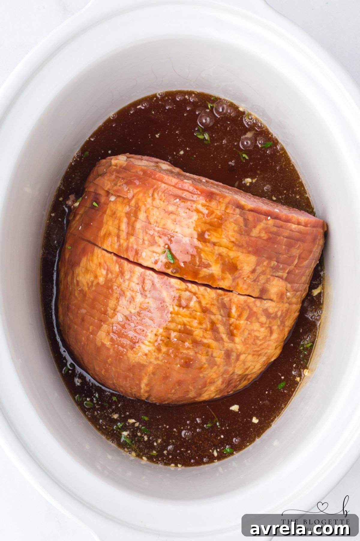 Add sauce over ham in crock pot