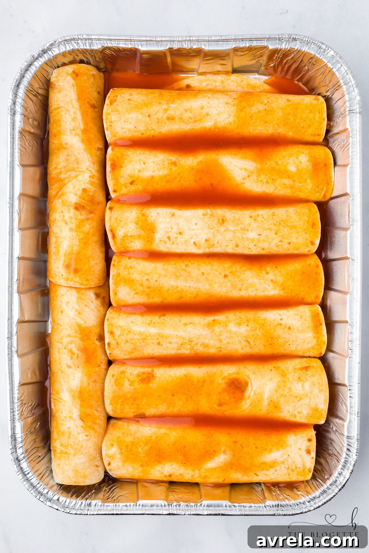 Cover with enchilada sauce